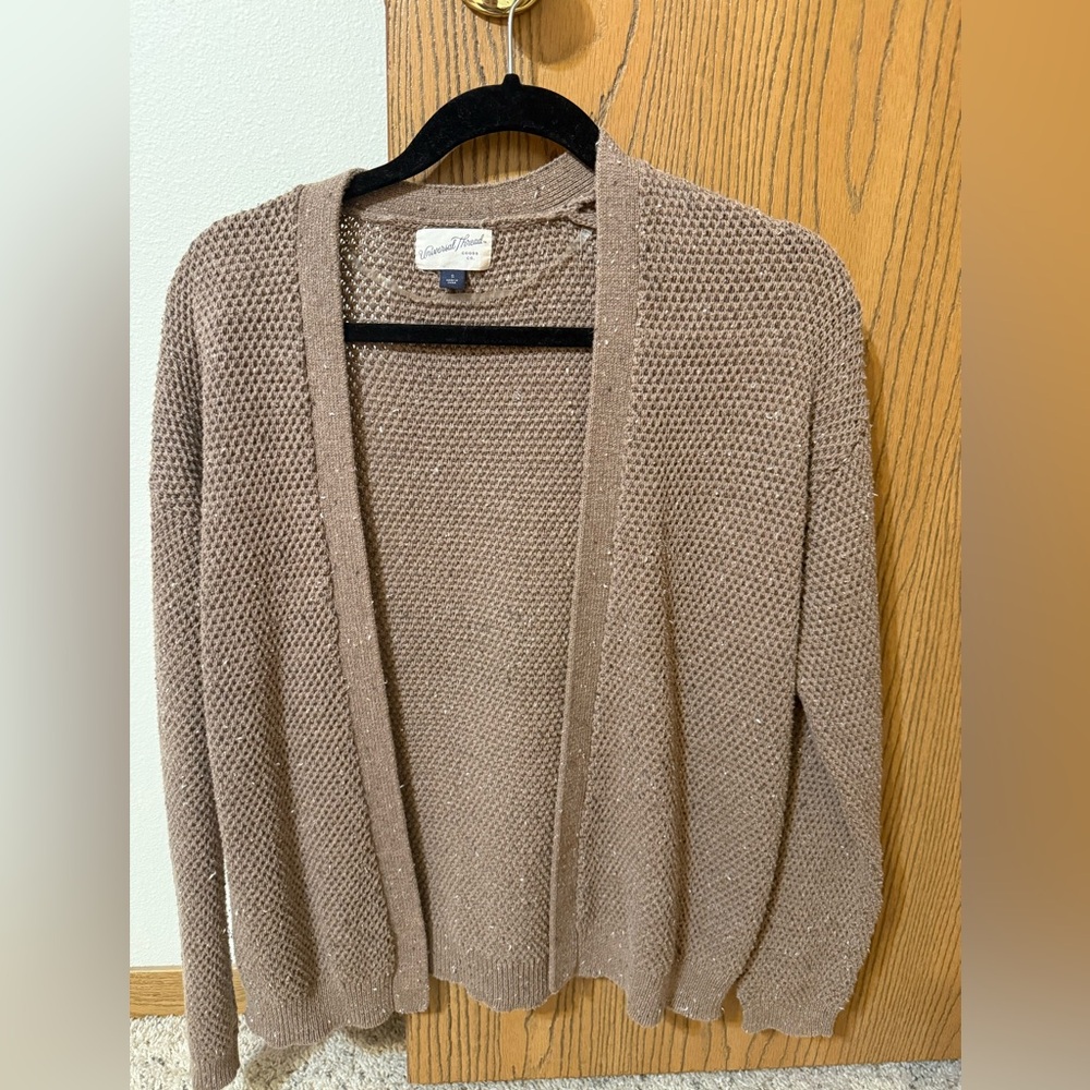 Brown knit cardigan sweater.